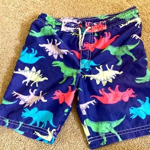 Dinosaur swim trunks, size 6